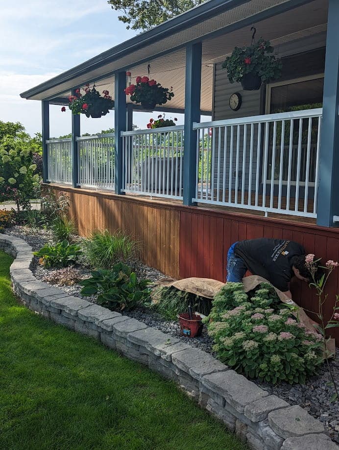 Deck staining in progress by Deck Revitalize crew